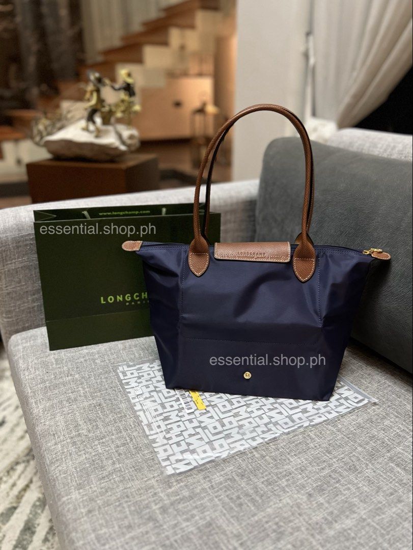 Bundle Promo! Longchamp Le Pliage Original Medium Long Handle Navy (Category: Luxury Bags & Wallets) located in Manila. Submitted by essential.shop.ph (Listing ID 1458019407, Image 3). Description: ON HAND ***Limited promo! Get a Trader Joe’s Pastel Tote with your purchase until Sept. 31, 2026 or until stocks last. Whichever comes first. Authentic Longchamp Le Pliage Original Medium Long Handle Navy Includes care card, LGP zip lock pouch and pape