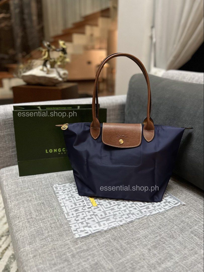 Bundle Promo! Longchamp Le Pliage Original Medium Long Handle Navy (Category: Luxury Bags & Wallets) located in Manila. Submitted by essential.shop.ph (Listing ID 1458019407, Image 2). Description: ON HAND ***Limited promo! Get a Trader Joe’s Pastel Tote with your purchase until Sept. 31, 2026 or until stocks last. Whichever comes first. Authentic Longchamp Le Pliage Original Medium Long Handle Navy Includes care card, LGP zip lock pouch and pape