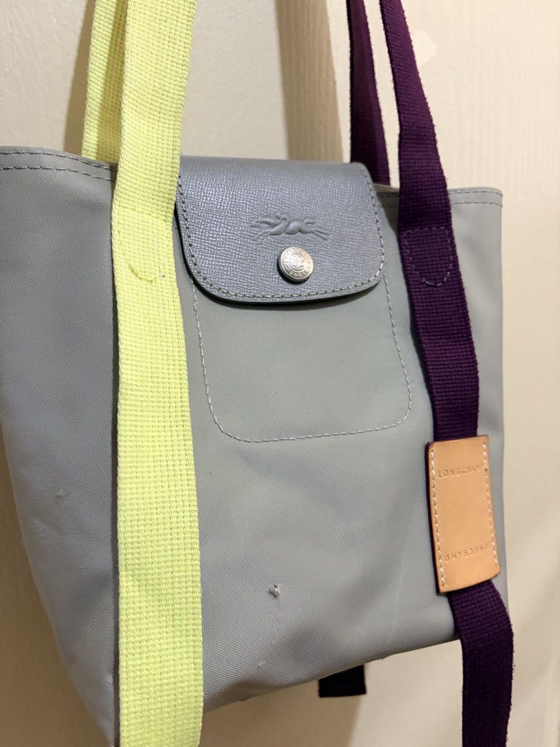 Longchamp Le Pliage Re-Play (Category: Shoulder Bags) located in Pasig City. Submitted by shopsmart.mnl (Listing ID 1458084721, Image 3). Description: Bought in JP Has issue. Nabutas sya ng maliit nung nadapa ako lol Was planning on filling it up with small patches pero sell ko na lang Fits a lot 17 × 20 × 12.5 cm.