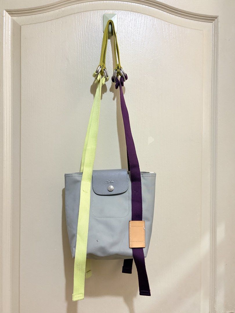 Longchamp Le Pliage Re-Play (Category: Shoulder Bags) located in Pasig City. Submitted by shopsmart.mnl (Listing ID 1458084721, Image 2). Description: Bought in JP Has issue. Nabutas sya ng maliit nung nadapa ako lol Was planning on filling it up with small patches pero sell ko na lang Fits a lot 17 × 20 × 12.5 cm.