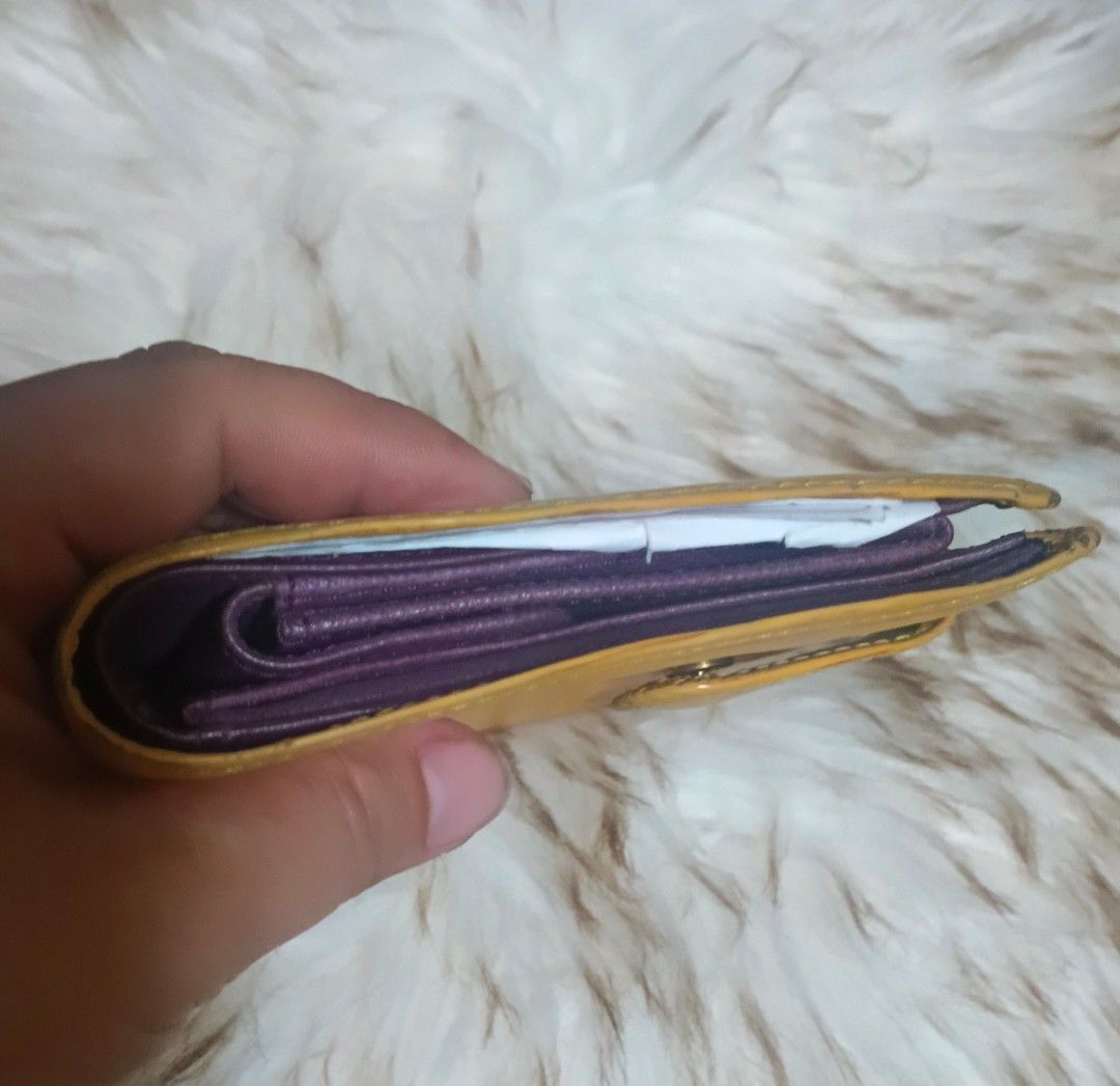 Louis Vuitton Epi Leather Bifold Wallet Yellow (Category: Luxury Bags & Wallets) located in Legazpi City. Submitted by georgepineda791 (Listing ID 1458080516, Image 3). Description: Preloved Louis Vuitton Epi Leather Compact Wallet A classic Louis Vuitton Viennois compact wallet crafted in iconic yellow Epi leather, featuring a contrasting purple interior and a practical, compact design. 📌Gold-tone hardware 📌Leather lining and pockets 📌Multipl