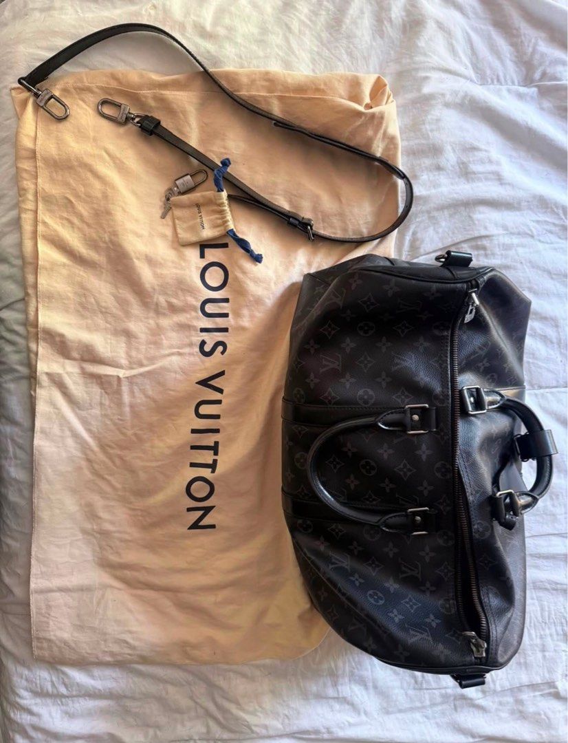 Louis Vuitton Keepall Bandouliere Monogram Eclipse 55 (Category: Luxury Bags & Wallets) located in San Pedro. Submitted by kpaniq (Listing ID 1457975729, Image 2). Description: - Authentic Louis Vuitton Keepall Bandouliere 55 - Monogram Eclipse canvas - Ideal for weekend trips or carry-on - Includes dust bag and shoulder strap - Good overall condition with some signs of wear on leather trim and handles.