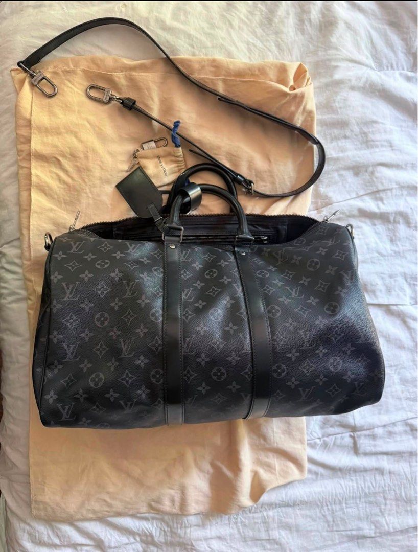 Louis Vuitton Keepall Bandouliere Monogram Eclipse 55 (Category: Luxury Bags & Wallets) located in San Pedro. Submitted by kpaniq (Listing ID 1457975729, Image 1). Description: - Authentic Louis Vuitton Keepall Bandouliere 55 - Monogram Eclipse canvas - Ideal for weekend trips or carry-on - Includes dust bag and shoulder strap - Good overall condition with some signs of wear on leather trim and handles.
