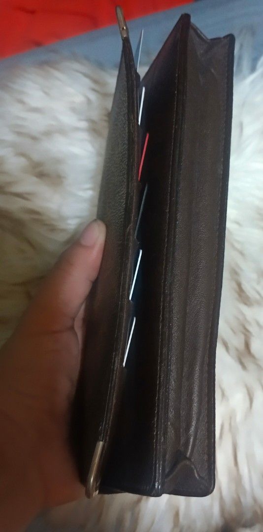 Louis Vuitton Monogram Canvas Long Wallet (Category: Luxury Bags & Wallets) located in Legazpi City. Submitted by georgepineda791 (Listing ID 1458081996, Image 3). Description: Preloved Louis Vuitton Long Wallet A classic and timeless Louis Vuitton long wallet featuring the iconic Monogram canvas design. It offers ample space for organizing cards, cash, and a checkbook, making it both practical and elegant. The wallet also features metal hardware