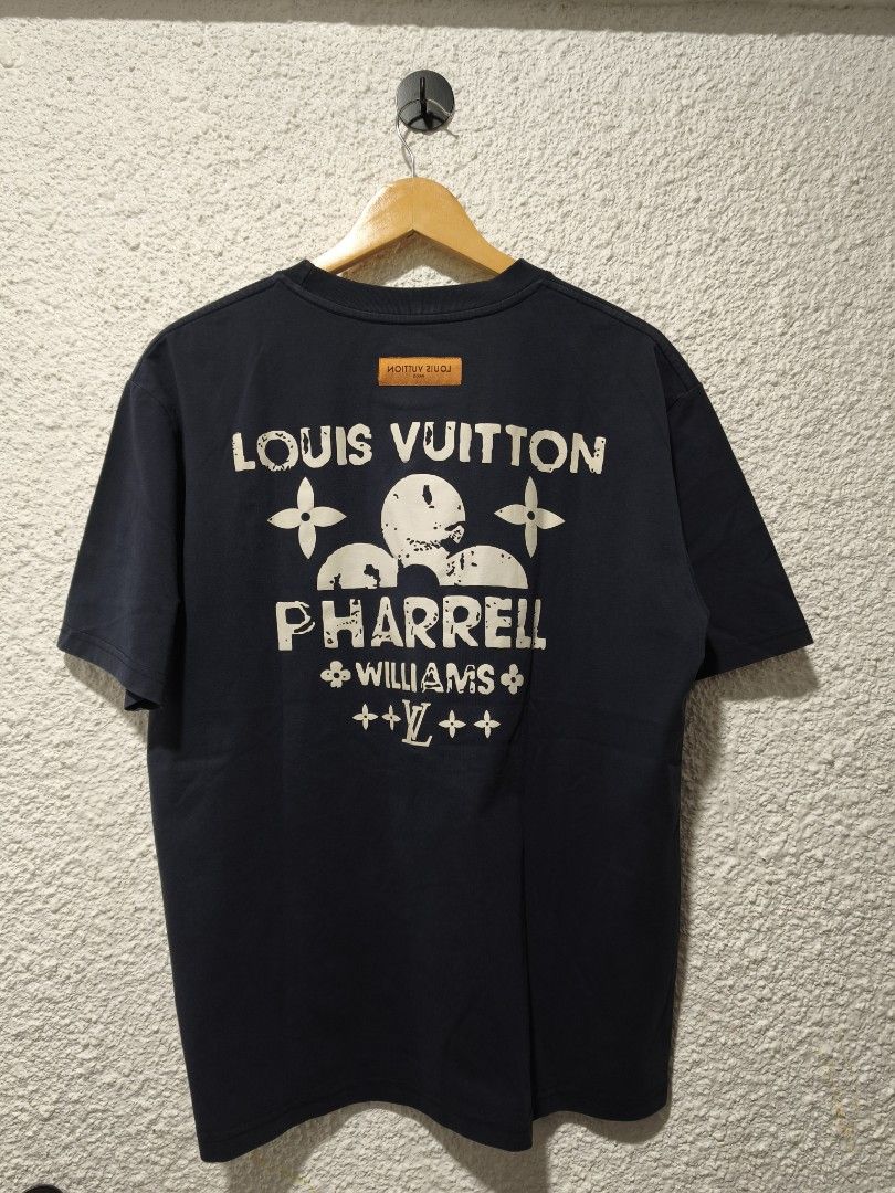 Louis Vuitton x Pharrell Williams T-shirt (Category: Tshirts & Polo Shirts ) located in Iloilo. Submitted by daddy_declutter (Listing ID 1458070034, Image 2). Description: L 26.5 x W 21 Navy blue t-shirt from Louis Vuitton and Pharrell Williams collaboration. Features graphic print on the back and small logo on the front. Made in China. Tagged MINGYIMING. Great piece for collectors..