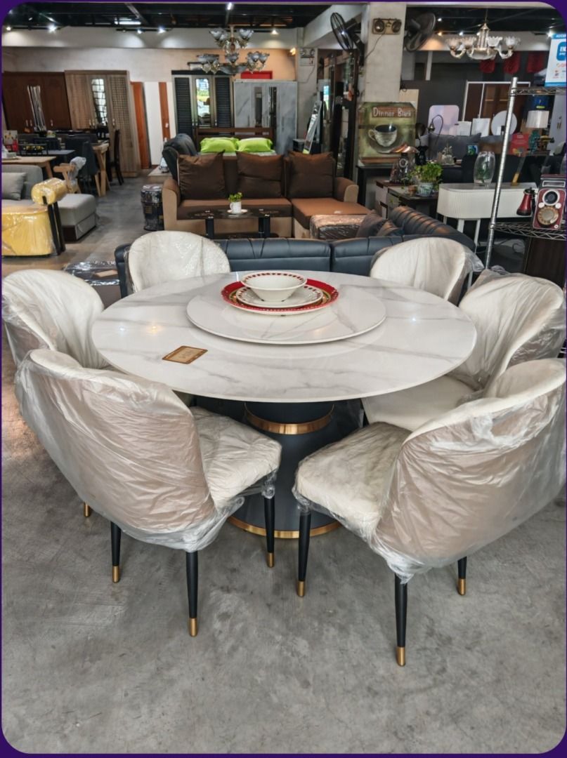 Marble Round Dining Table with 6 Chairs (Category: Tables & Sets) located in Manila. Submitted by yhel21 (Listing ID 1457971530, Image 2). Description: - Round marble dining table with built-in lazy susan - Includes 6 upholstered chairs in light cream fabric (still in original plastic wrapping!) - Stylish black table base with elegant gold accents - Ideal for family meals and hosting guests - Adds a touch of luxury to your dining space.
