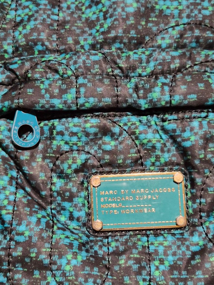Marc by Marc Jacobs Pretty Nylon Knapsack Parakeet Multi (Category: Luxury Bags & Wallets) located in Mandaue City. Submitted by chuchi152615 (Listing ID 1458083814, Image 2). Description: - Marc by Marc Jacobs backpack - Cool green and black print - Quilted nylon material - Front pocket for easy access - Adjustable straps for comfort - Signature Marc Jacobs logo zipper pull - Ideal for everyday use or travel.