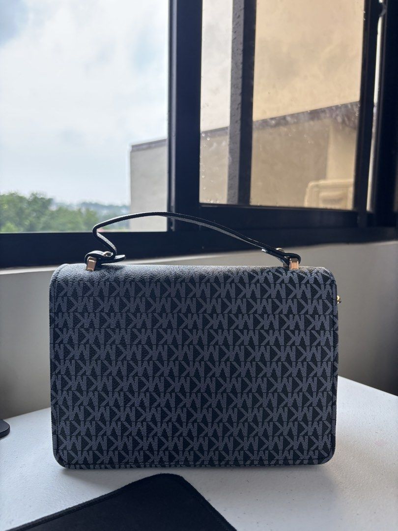 Handbag in Black (with removable strap) (Category: Luxury Bags & Wallets) located in Quezon City. Submitted by dubidapp (Listing ID 1457974874, Image 2). Description: MK, mirrored Outside pocket width: 7 in. Outside pocket height: 4.2 in. Main compartment width: 8 in. Main compartment height: 5.1 in. .