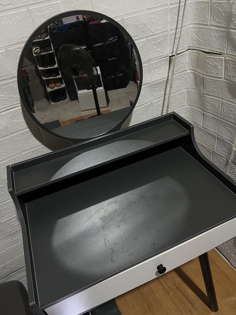 Modern Dressing Table with Mirror and Drawer (Category: Tables & Sets) located in Santa Rosa. Submitted by truecat.9d0628 (Listing ID 1458079716, Image 1). Description: - Compact dressing table with round mirror - Single storage drawer - Tabletop shelf for organization - Sleek white and dark grey finish - Black, angled legs - Ideal for small spaces.