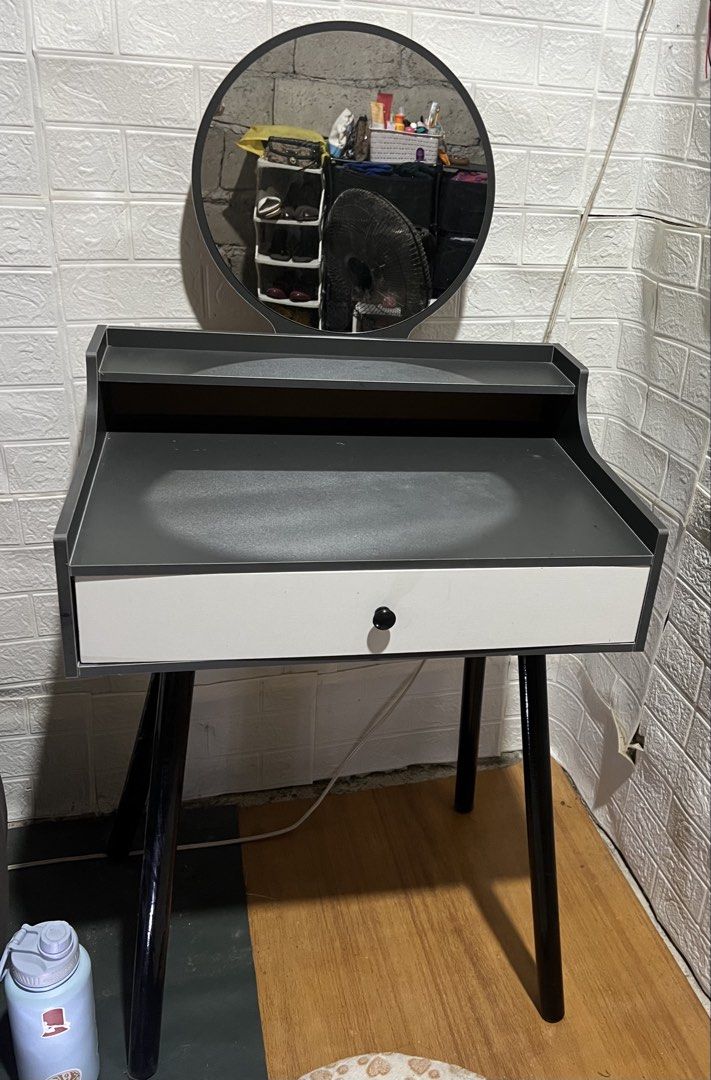 Modern Dressing Table with Mirror and Drawer (Category: Tables & Sets) located in Santa Rosa. Submitted by truecat.9d0628 (Listing ID 1458079716, Image 3). Description: - Compact dressing table with round mirror - Single storage drawer - Tabletop shelf for organization - Sleek white and dark grey finish - Black, angled legs - Ideal for small spaces.