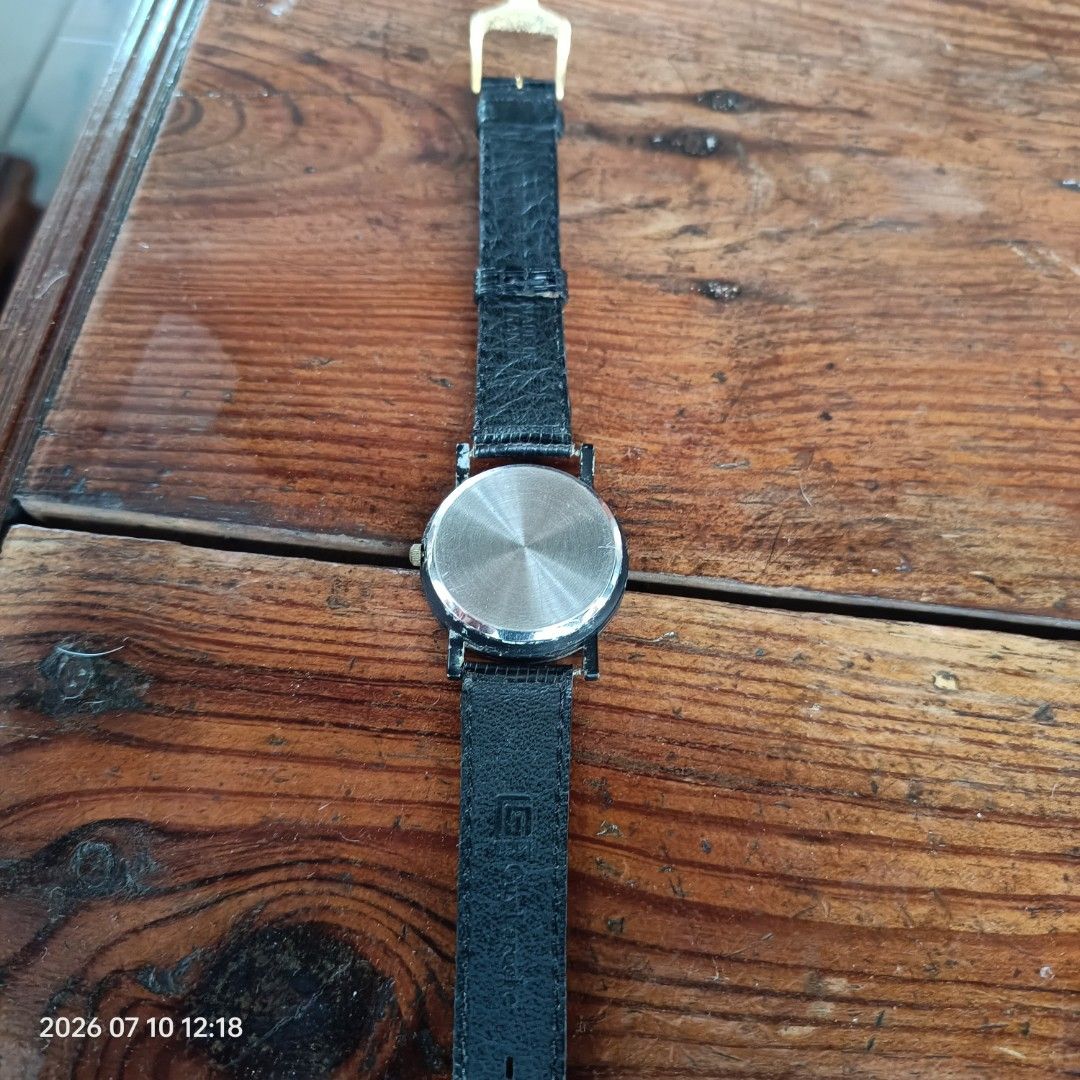 Movado Quartz Watch Black Dial (Category: Luxury Watches) located in Calasiao. Submitted by anthonypeter (Listing ID 1448734793, Image 3). Description: - Movado Watch - Classic Black Dial - Gold-Toned Hands & Markers - Black Textured Strap - Reliable Quartz Movement - Perfect for Everyday Wear.