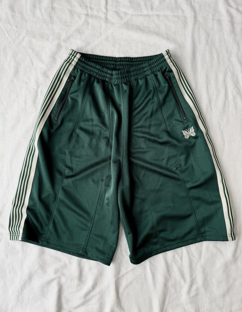 Needles LHP track short green poly ( baggy ) (Category: Shorts) located in Pasig City. Submitted by paymelikelandlord (Listing ID 1458092337, Image 1). Description: SALE ONLY Needles LHP track short green poly ( baggy ) Hunter green color way Excellent condition as new No hidden issue no flaw .