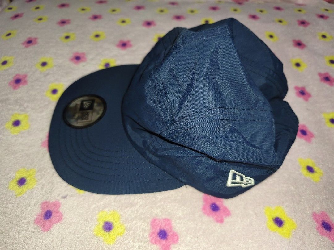 New Era Navy Blue 5-Panel Adjustable Cap (Category: Caps & Hats) located in Bulacan. Submitted by THA_D_THRIFT (Listing ID 1458072195, Image 2). Description: - Brand: New Era - Color: Navy Blue - Design: 5-panel - Closure: Adjustable strap at the back - Material: 100% Nylon - Sizing: One size fits most - Style: Simple, classic, great for everyday wear 1250 + SF.