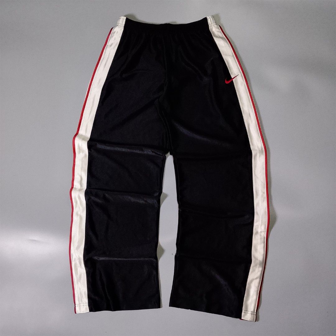 Vintage Nike Track Pants (Category: Joggers) located in Taguig. Submitted by 8kthrifter (Listing ID 1457960497, Image 1). Description: Size: Extra Large Waist: 34 (adjustable) Length: 39 Thigh: 13 Hem: 10 Color Rate: 10/10 Issue: minor heel drag (see last photo) Ukay/Thrifted Excellent Condition.