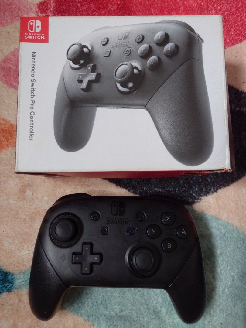 Nintendo Switch Pro Controller (last price) (Category: Controllers) located in Quezon City. Submitted by roshanmerchantlab (Listing ID 1458083495, Image 1). Description: - Includes original box - Excellent for Nintendo Switch gaming - All buttons and joysticks fully functional - Ready for its new owner ⚠️ Unli-check sa meet-up or video call or send more vids/pics 📍Novaliches, Quezon City (near SM Novaliches) 🚚 Meet-up, pick-up, lalamove and J&T