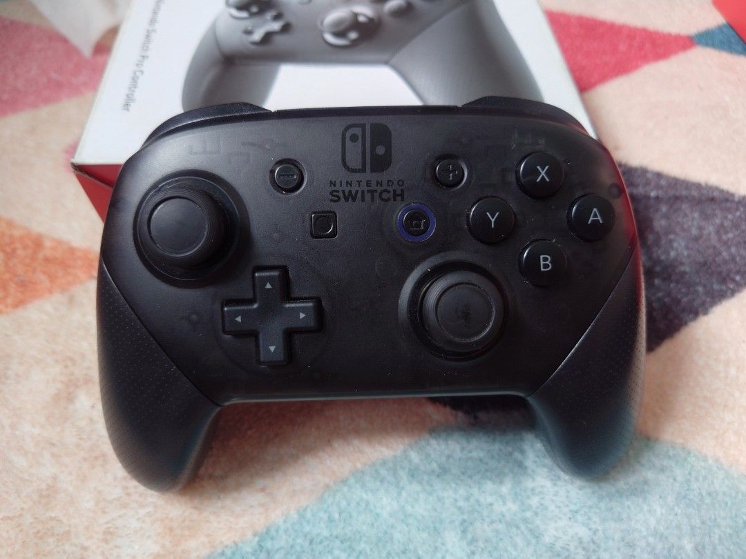 Nintendo Switch Pro Controller (last price) (Category: Controllers) located in Quezon City. Submitted by roshanmerchantlab (Listing ID 1458083495, Image 2). Description: - Includes original box - Excellent for Nintendo Switch gaming - All buttons and joysticks fully functional - Ready for its new owner ⚠️ Unli-check sa meet-up or video call or send more vids/pics 📍Novaliches, Quezon City (near SM Novaliches) 🚚 Meet-up, pick-up, lalamove and J&T