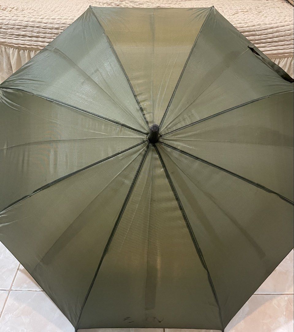 olive green long-handled umbrella with an eight-panel canopy (Category: Umbrellas) located in San Fernando. Submitted by japansurpluselyu (Listing ID 1457926296, Image 1). Description: .