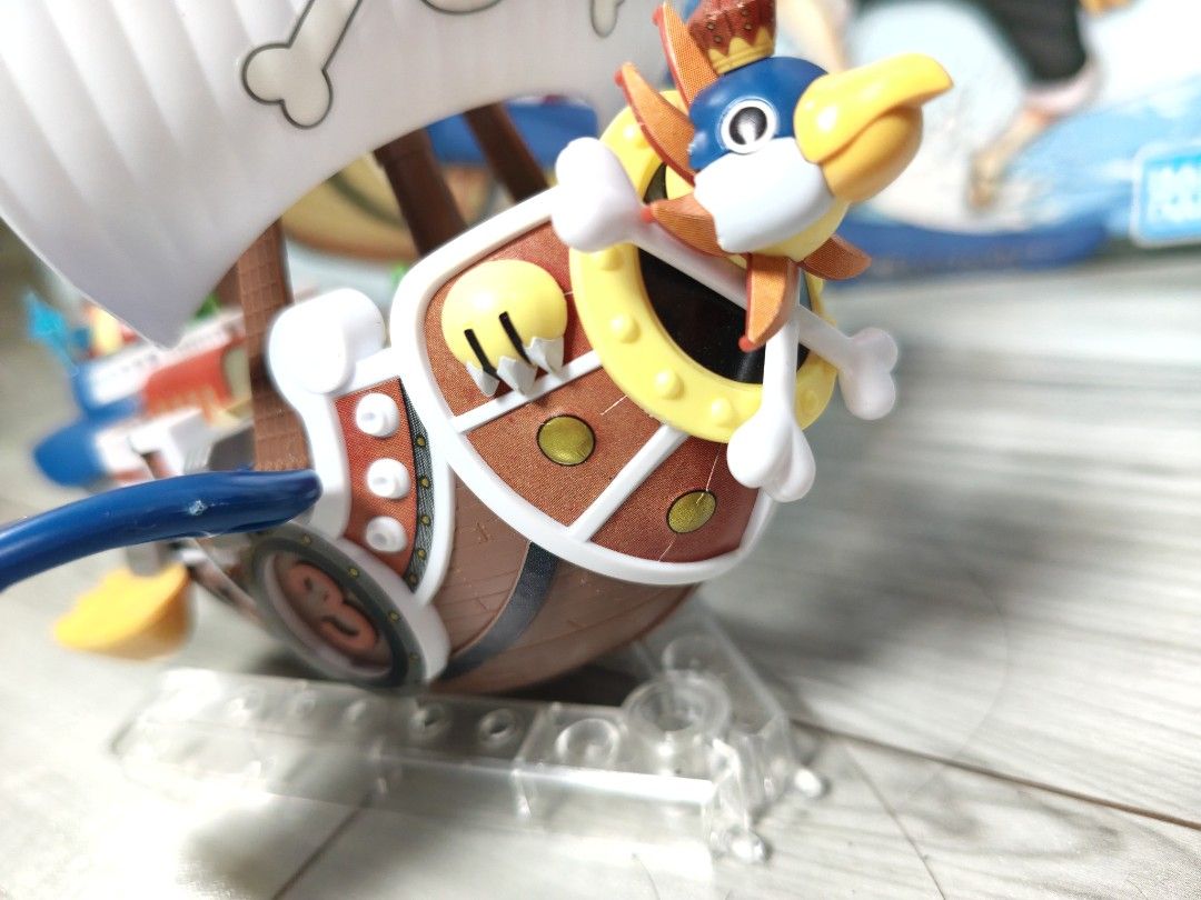 One Piece Stampede Thousand Sunny Model Kit (Category: Gundam & Model Kits) located in Bocaue. Submitted by aphroditeee. (Listing ID 1457920235, Image 2). Description: - Assembled Thousand Sunny model from One Piece Stampede - Bandai model kit - Includes original box - Displayed on a stand - Complete parts - will disassemble for shipping - slight discoloration on the front left part (can be painted, discolored sticker only).