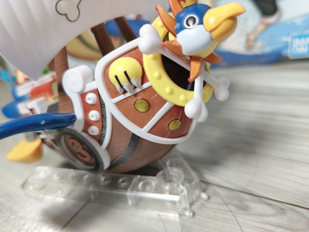 One Piece Stampede Thousand Sunny Model Kit (Category: Gundam & Model Kits) located in Bocaue. Submitted by aphroditeee. (Listing ID 1457920235, Image 3). Description: - Assembled Thousand Sunny model from One Piece Stampede - Bandai model kit - Includes original box - Displayed on a stand - Complete parts - will disassemble for shipping - slight discoloration on the front left part (can be painted, discolored sticker only).