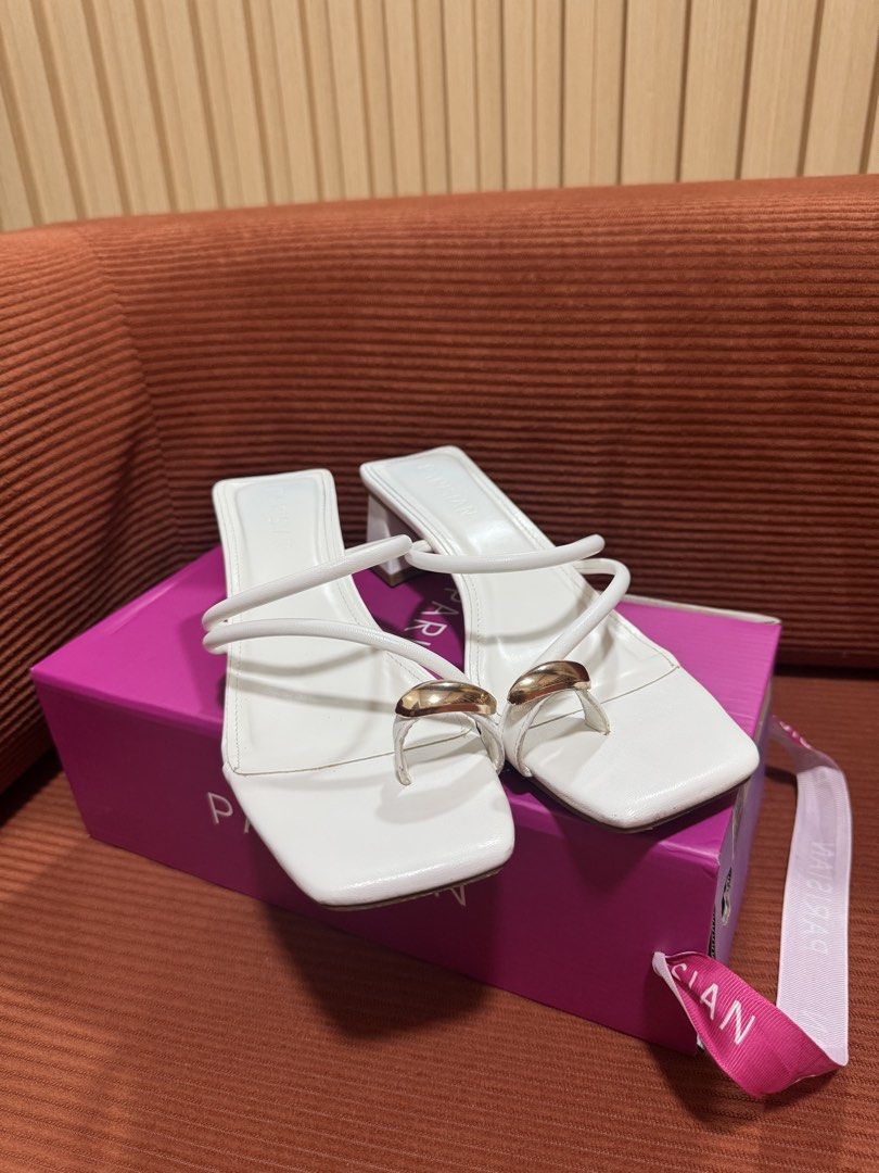 PARISIAN White Square Strappy Heels/ Sandals (Category: Flats & Sandals) located in Manila. Submitted by declutterdoctor (Listing ID 1458040895, Image 1). Description: - Parisian white heeled sandals - Size 7, 24cm - Used 3x ONLY - Square toe - Toe-loop design - Strappy with gold accent detail - Block heel - Comes with original box - Perfect for formal occasions.