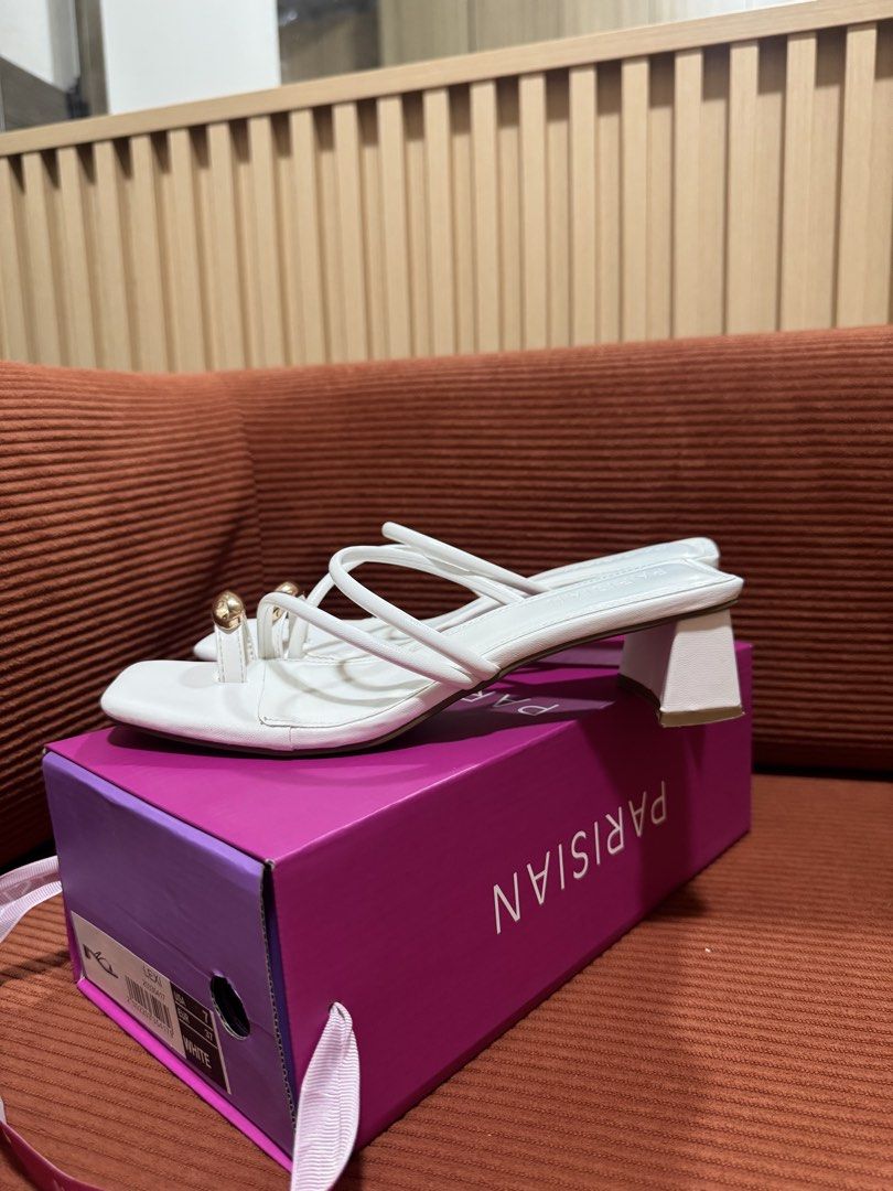 PARISIAN White Square Strappy Heels/ Sandals (Category: Flats & Sandals) located in Manila. Submitted by declutterdoctor (Listing ID 1458040895, Image 3). Description: - Parisian white heeled sandals - Size 7, 24cm - Used 3x ONLY - Square toe - Toe-loop design - Strappy with gold accent detail - Block heel - Comes with original box - Perfect for formal occasions.