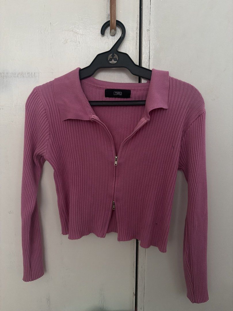 Pink Ribbed Zipper Collar Cardigan (Category: Coats, Jackets and Outerwear) located in Pasig City. Submitted by amjans (Listing ID 1457973191, Image 1). Description: - Pink ribbed cardigan from COPPER - Zipper closure with a collar - Long sleeves with ribbed cuffs - Ribbed hem with a lettuce edge - Estimated size: Small to Medium - Versatile for layering or wearing solo.
