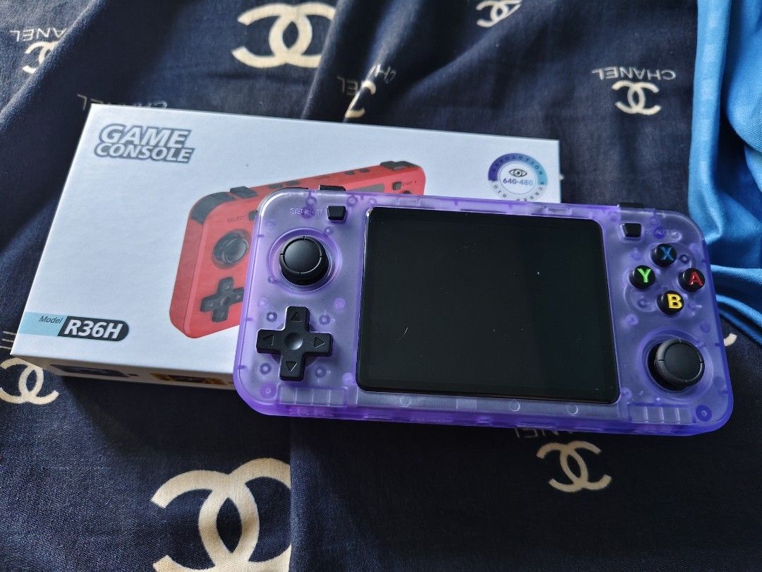 POCKET BOY CONSOLE (Category: Others) located in Quezon City. Submitted by chagchag28 (Listing ID 1457933505, Image 1). Description: - Purple R36H handheld game console - Includes original box - Rechargeable Li-Po 3000mAh battery - Ideal for retro gaming on the go.