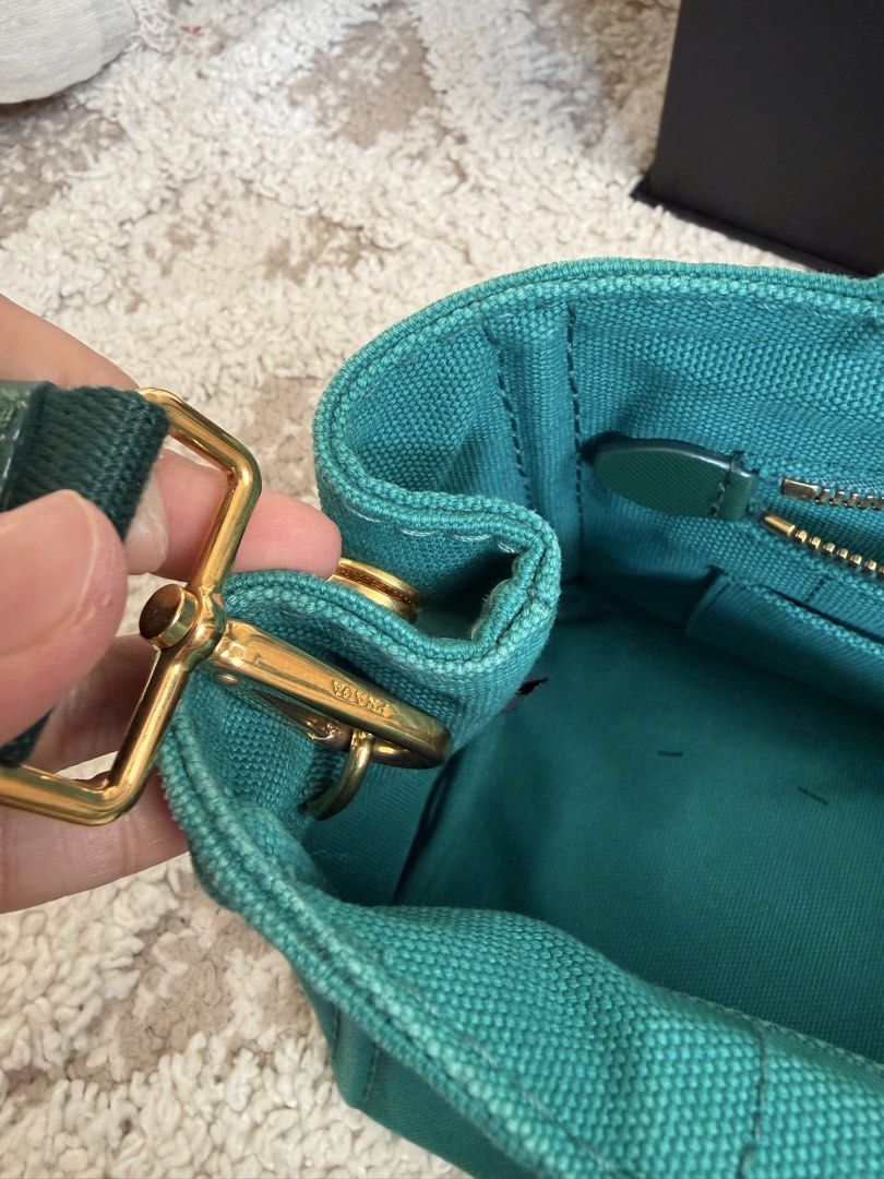Prada canapa (Category: Cross-body Bags) located in Manila. Submitted by aleon21 (Listing ID 1458025959, Image 3). Description: Posted all photos With COA and generic dustbag This is like new all hardwares super gold.