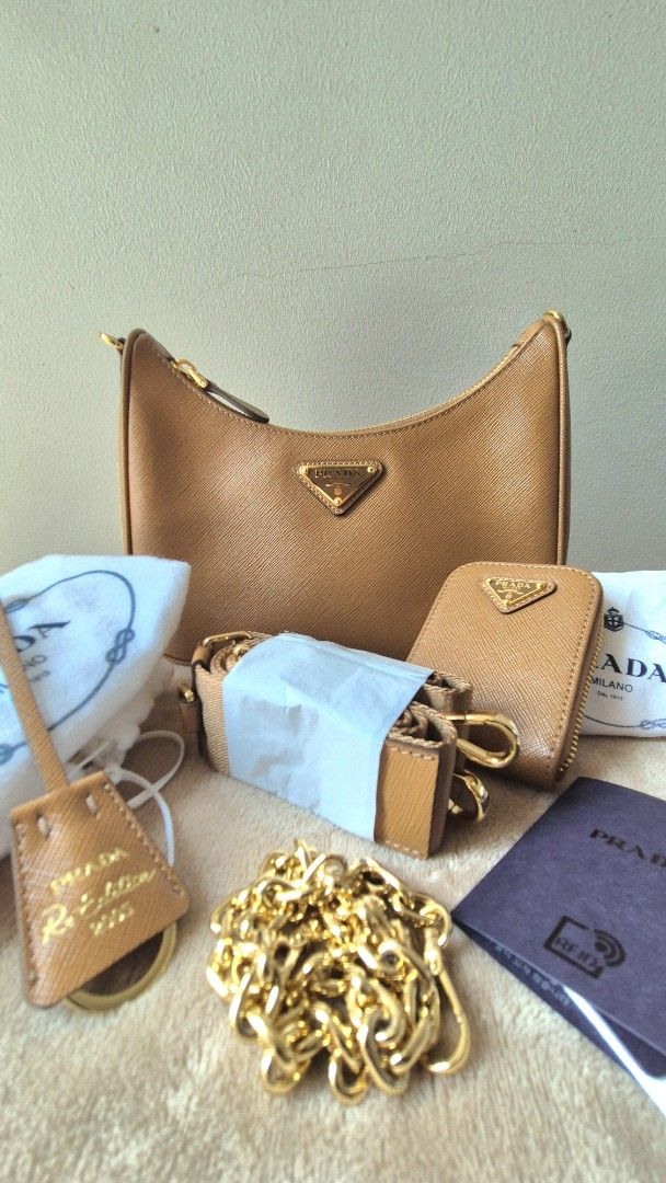 UNUSED: Prada Re-Edition (Category: Luxury Bags & Wallets) located in Makati City. Submitted by shop_at_my_cart (Listing ID 1457919727, Image 1). Description: - Authentic Prada re edition bag - Color: Caramel Brown - Material: Saffiano Leather - Includes: Dust bag, authenticity card, strap, chain,purse - Ideal for carrying essentials.