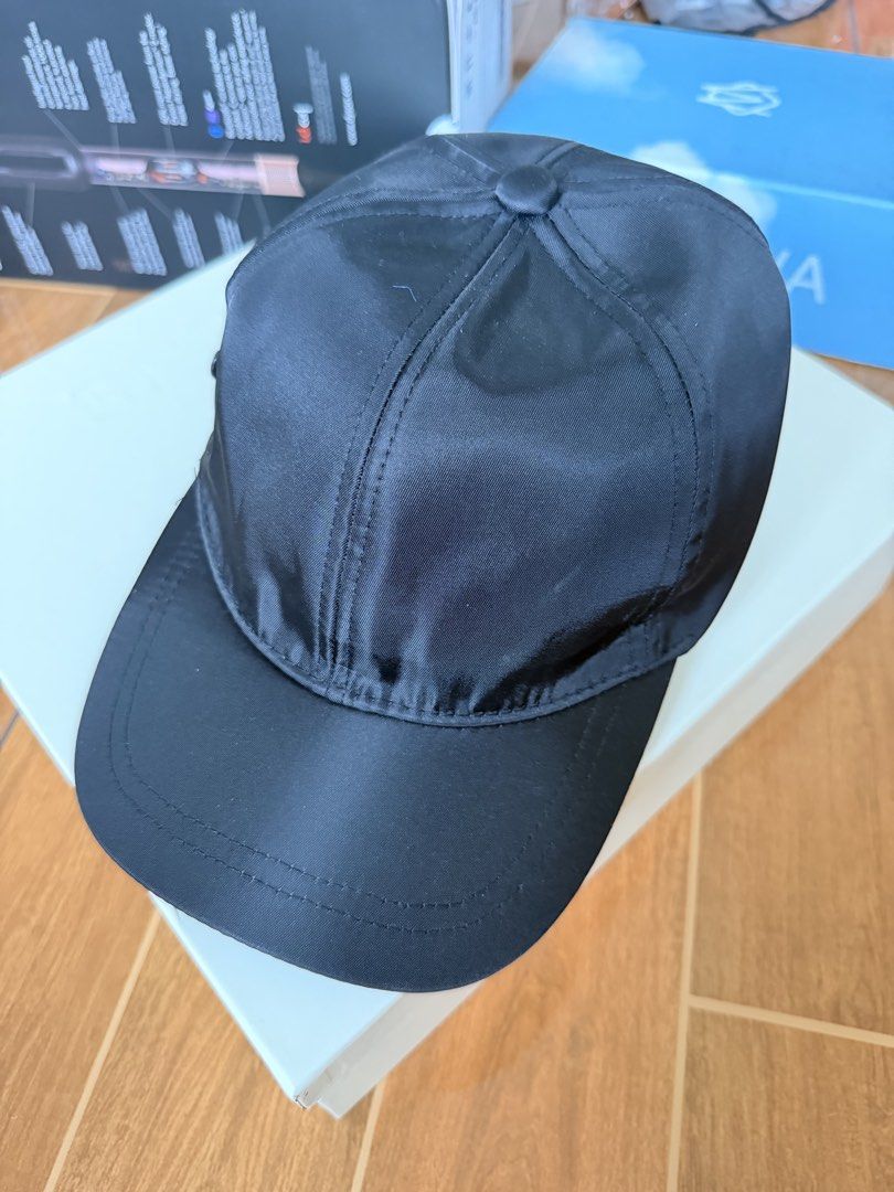 Pr@da Black Nylon Cap (Category: Caps & Hats) located in Las Pinas. Submitted by twiceloved24 (Listing ID 1457972380, Image 2). Description: - Black nylon material - Iconic Prada triangle logo on front - Adjustable strap for a comfortable fit - Ideal for everyday wear.