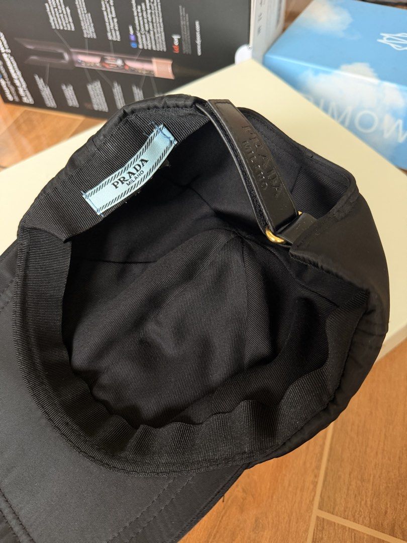 Pr@da Black Nylon Cap (Category: Caps & Hats) located in Las Pinas. Submitted by twiceloved24 (Listing ID 1457972380, Image 3). Description: - Black nylon material - Iconic Prada triangle logo on front - Adjustable strap for a comfortable fit - Ideal for everyday wear.