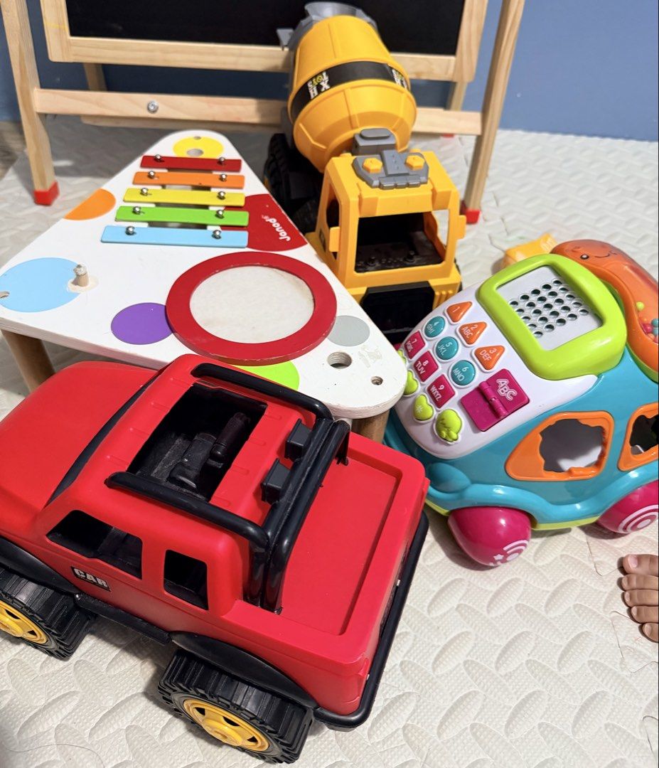 Preloved Toddler Toy Bundle (Janod + Interactive Toys & Trucks) (Category: Infant Playtime) located in Manila. Submitted by declutter_sis (Listing ID 1458095264, Image 1). Description: Condition: Good preloved condition, clean, and fully functional. Price: ₱1,000 for all (or best offer) Inclusions: - Janod French Wooden Musical Table (Note: Missing sticks/cymbals, but xylophone & drum are in great working condition) - Interactive Toy Car / Phone 