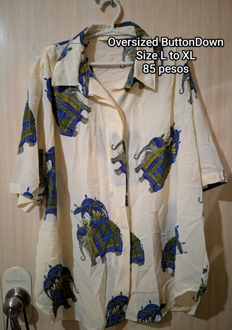 Printed Button Down Polo (Category: Blouses) located in Cebu City. Submitted by anythingpretty04 (Listing ID 1457909767, Image 1). Description: one of my favorite pieces, baggy fitting. complete buttons ( hidden ) , elephant print..