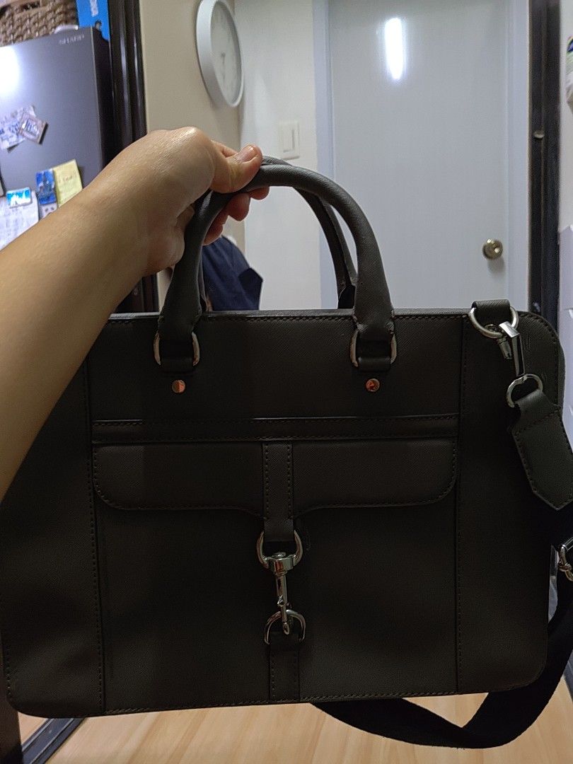 Rebecca Minkoff Grey Laptop Bag (Category: Luxury Bags & Wallets) located in Cagayan de Oro. Submitted by ps1030 (Listing ID 1457988974, Image 1). Description: - Brand: Rebecca Minkoff - Color: Grey - Material: Saffiano Leather - Features: Signature metal logo plate, comes with a black strap - Size: Ideal for everyday use.