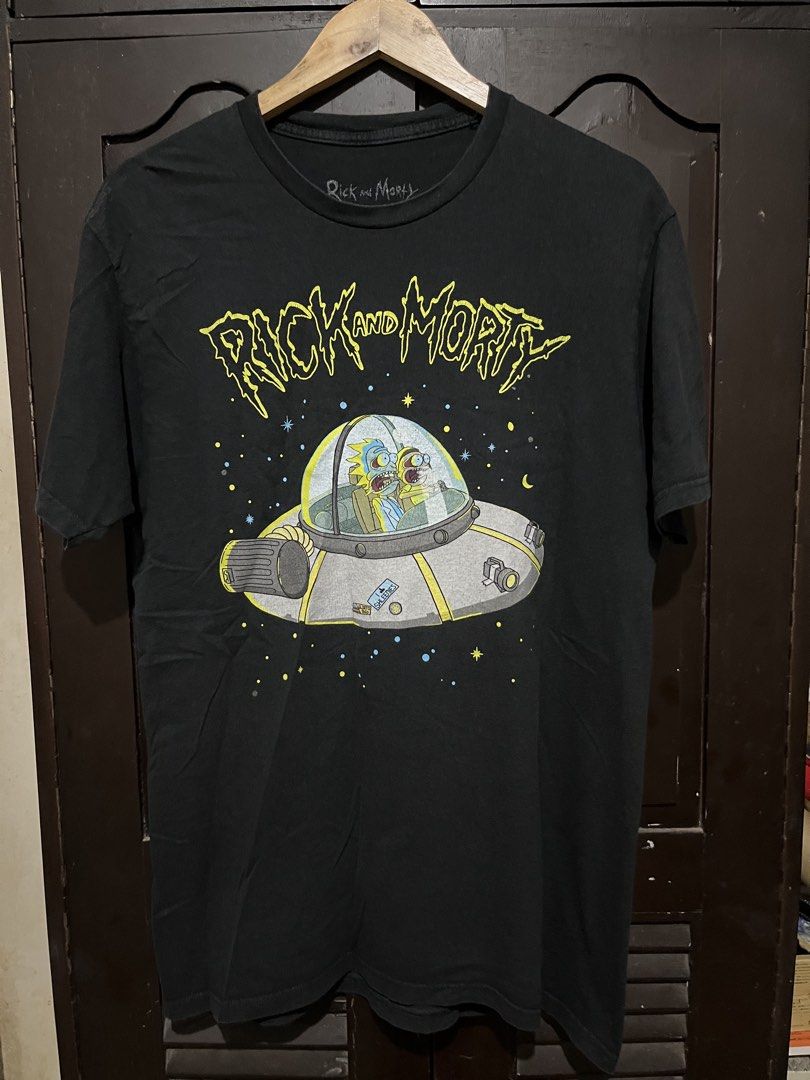 Rick and Morty Merch Tee (Category: Tshirts & Polo Shirts ) located in Santa Cruz. Submitted by wecareaboutthingswedonothave (Listing ID 1458059219, Image 1). Description: Width - 21 Length - 30 Large on tag Issue: Cracked prints. See picture .