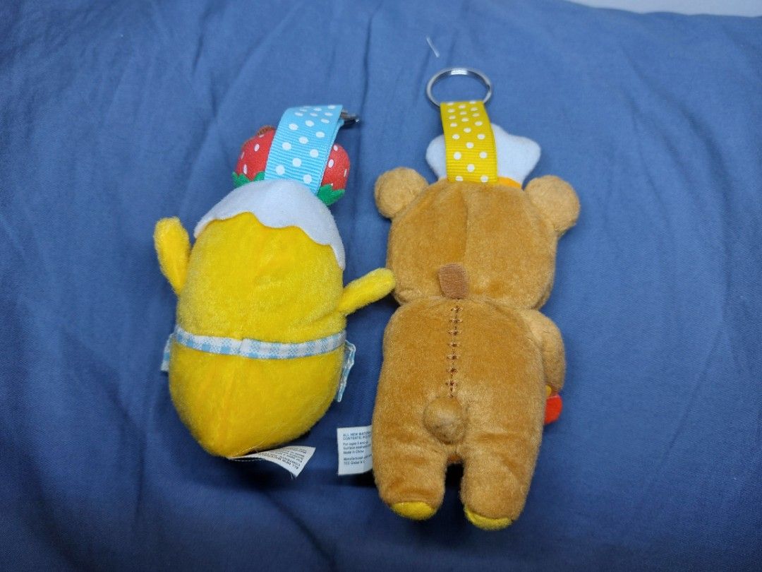 Rilakkuma Cafe Bear & Kiiroitori Chick Plush Keychains Bundle (Category: Plushies & Soft Toys) located in Mandaluyong City. Submitted by 13thsilverrabbit (Listing ID 1457904225, Image 2). Description: - Adorable Rilakkuma cafe bear plush keychain with coffee cup. - Cute Kiiroitori chick plush keychain dressed as a chef, with strawberries. - Both feature attached keyrings. - Officially from San-X. - Ideal for decorating bags, backpacks, and more..