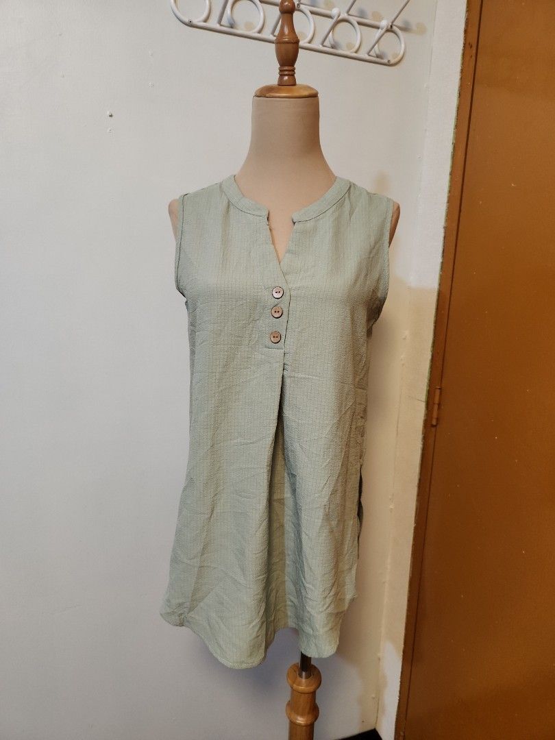 Sage green sleeveless Small to med (Category: Blouses) located in Marikina City. Submitted by KanamiFinds (Listing ID 1458062716, Image 1). Description: bust: 36 inches length:26 inches from the shoulders.