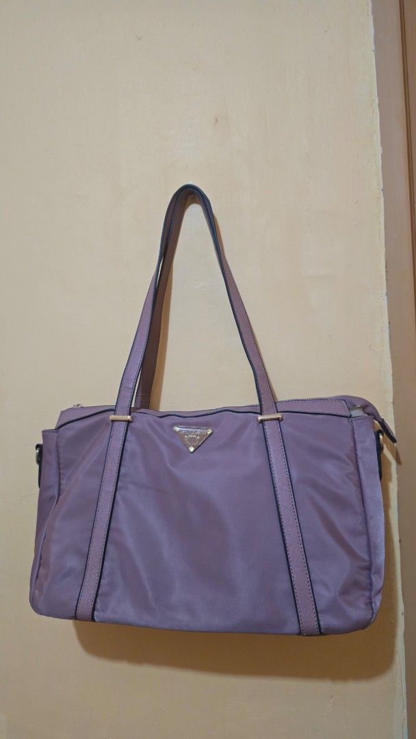 Secosana 2 way tote bag (Category: Tote Bags) located in Balamban. Submitted by macabebe (Listing ID 1458023341, Image 1). Description: - Elegant gold hardware - Durable nylon-like material - Two comfortable shoulder straps with one long strap - Ideal for everyday errands or travel adventures.