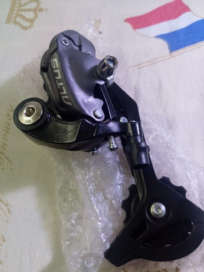 Shimano Altus Rear Derailleur for Bicycle (Category: Bicycles) located in Taytay. Submitted by danielprad78683 (Listing ID 1457996368, Image 1). Description: - Shimano Altus rear derailleur - Sleek black finish - Perfect for upgrading your bike's drivetrain - Message for inquiries.