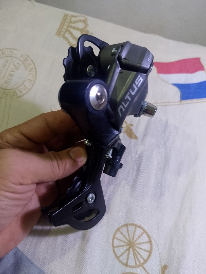 Shimano Altus Rear Derailleur for Bicycle (Category: Bicycles) located in Taytay. Submitted by danielprad78683 (Listing ID 1457996368, Image 3). Description: - Shimano Altus rear derailleur - Sleek black finish - Perfect for upgrading your bike's drivetrain - Message for inquiries.