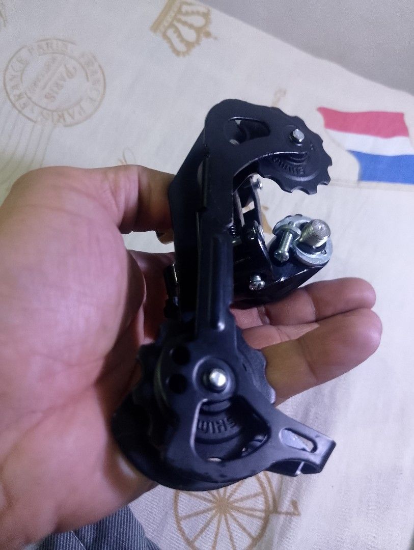 Shimano Altus Rear Derailleur for Bicycle (Category: Bicycles) located in Taytay. Submitted by danielprad78683 (Listing ID 1457996368, Image 2). Description: - Shimano Altus rear derailleur - Sleek black finish - Perfect for upgrading your bike's drivetrain - Message for inquiries.