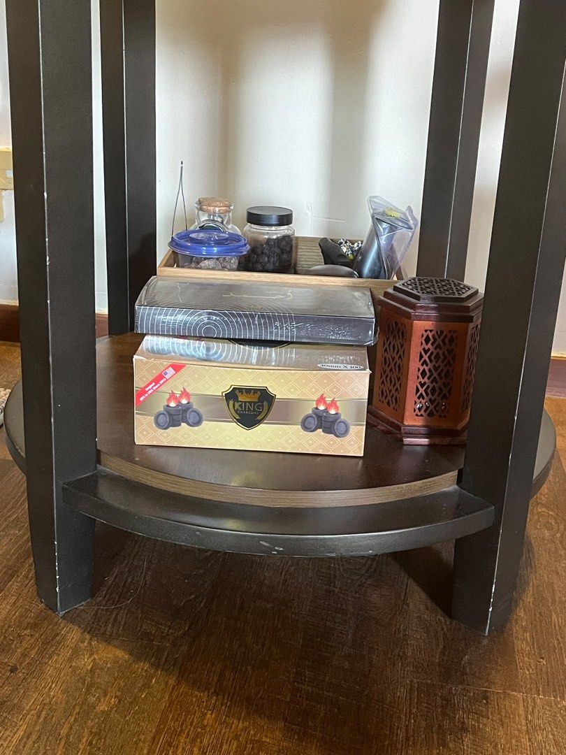Side table (Category: Tables & Sets) located in Singapore. Submitted by the.petite.wardrobe (Listing ID 1457923448, Image 2). Description: - Round side table - Lower shelf for extra storage - Ideal for living room or bedroom - Height: 64cm Diameter: 59cm - Not for fussy buyer.