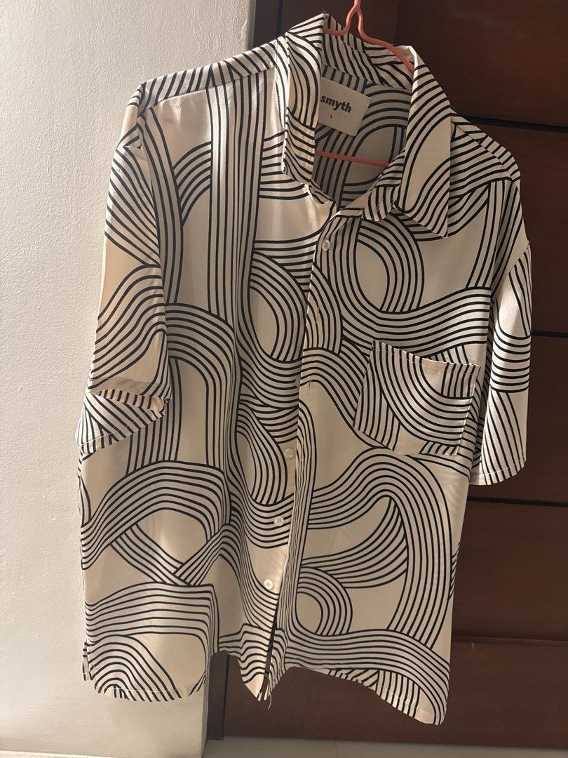 Smyth Short Sleeve Button Up Shirt Size L (Category: Tshirts & Polo Shirts ) located in Bacoor. Submitted by cosmic_keonho (Listing ID 1458052076, Image 1). Description: - Smyth short sleeve shirt - Length 28 inches / Width 24 inches - Unique abstract line pattern all over - Button up front - 1 chest pocket - Size L - Great for casual wear or a statement piece.