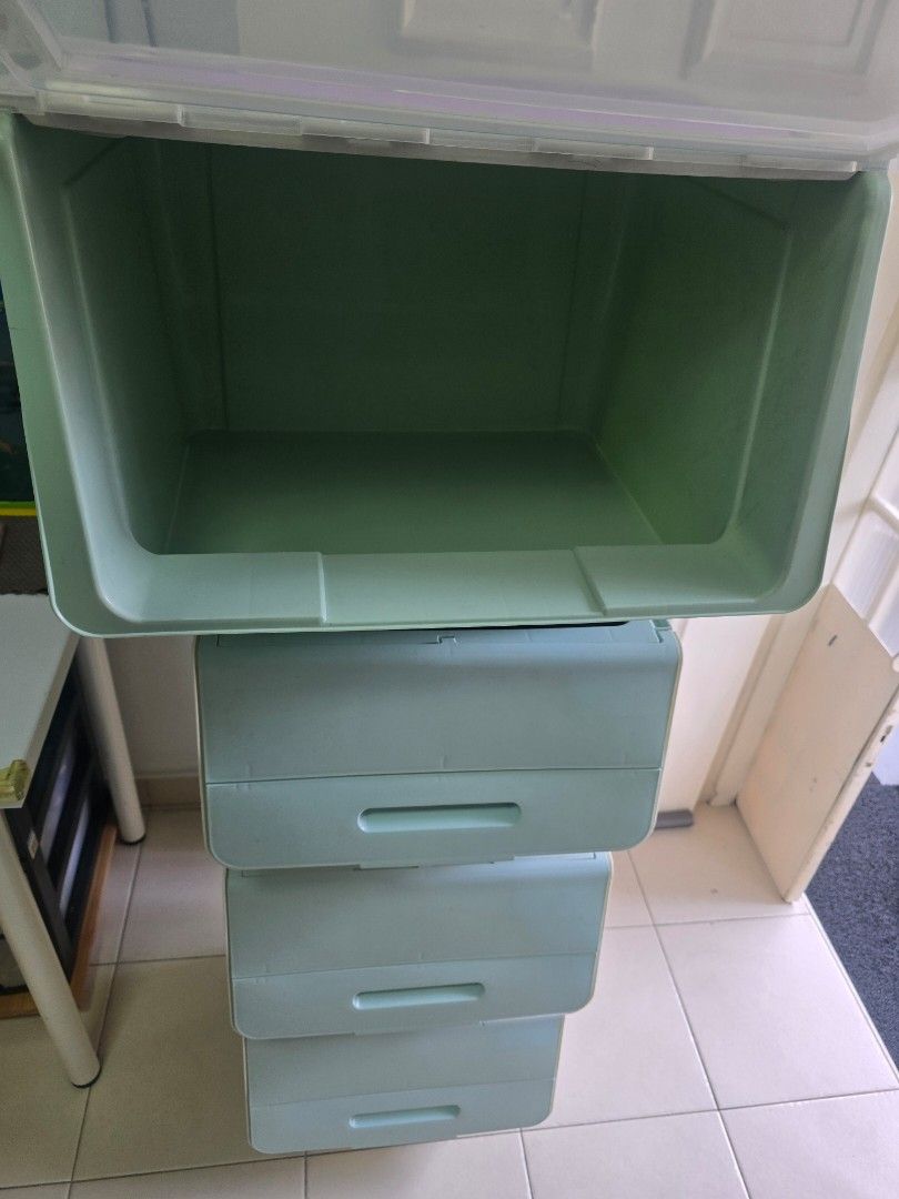 Stackable Storage Boxes with Lids (Category: Storage Boxes & Baskets) located in Singapore. Submitted by uncle_steven (Listing ID 1457946428, Image 3). Description: - Set of 4 stackable storage boxes with lids - 1 Large clear box with a green tint - 3 Small light blue boxes - Boxes stack neatly for space-saving organization - Perfect for storing toys, clothes, or general. a household items - All 4 boxes sold as a set. all for $10. self collect at