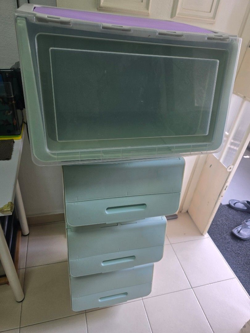 Stackable Storage Boxes with Lids (Category: Storage Boxes & Baskets) located in Singapore. Submitted by uncle_steven (Listing ID 1457946428, Image 1). Description: - Set of 4 stackable storage boxes with lids - 1 Large clear box with a green tint - 3 Small light blue boxes - Boxes stack neatly for space-saving organization - Perfect for storing toys, clothes, or general. a household items - All 4 boxes sold as a set. all for $10. self collect at