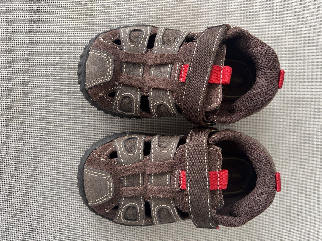 STRIDE RITE (Category: Babies & Kids Fashion) located in Kuala Lumpur. Submitted by nurulmz (Listing ID 1458013931, Image 2). Description: - Brand: Stride Rite - Type: Kids' Sandals - Color: Brown with red accents - Material: Suede and canvas upper - Closure: Adjustable hook-and-loop strap - Features: Durable sole with good grip, breathable design - Size: US6.5W, UK6, EU23.