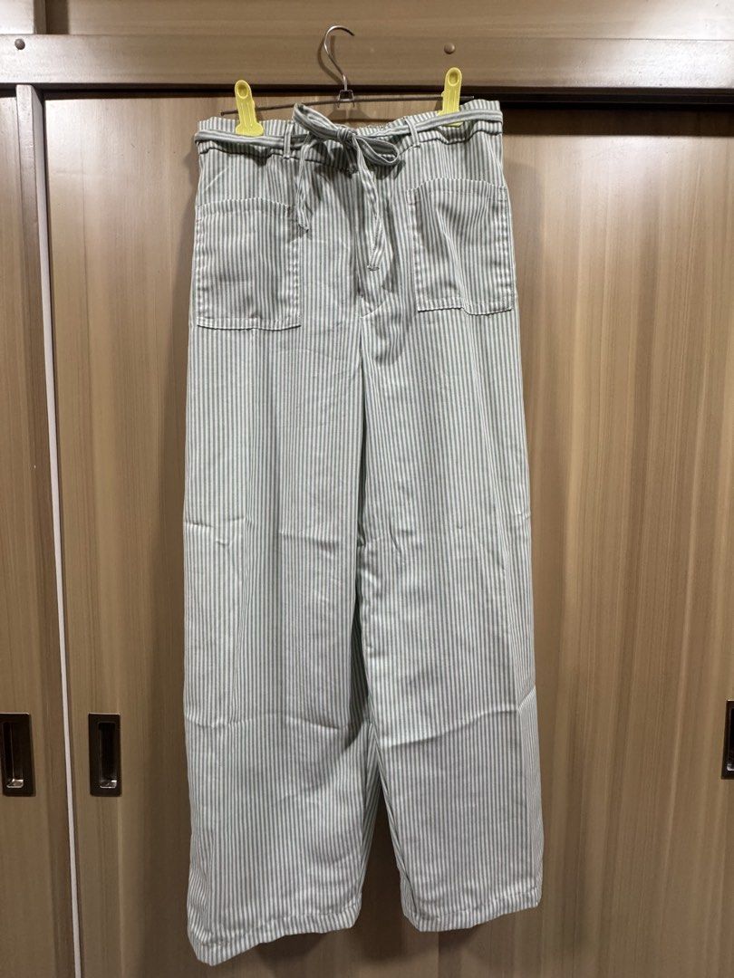 Stripes Linen Pants (Category: Other Bottoms) located in Manila. Submitted by declutterdoctor (Listing ID 1458039906, Image 1). Description: - Hip Goddess Green Striped Linen Pants - Fits size 26-29 - Linen material - Garterized back detail - Used TWICE only.