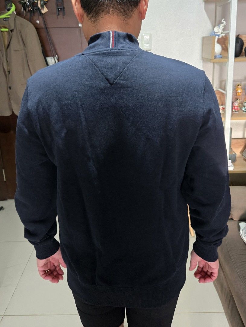 Tommy Hilfiger Navy Blue Bomber Jacket (Category: Coats, Jackets and Outerwear) located in Quezon City. Submitted by mgdeclutters (Listing ID 1457983720, Image 2). Description: - Navy blue Tommy Hilfiger bomber jacket - Full zip front with pockets - Ribbed cuffs and hem for a snug fit - Small Tommy Hilfiger flag logo on the chest - Ideal for everyday casual wear - Brand new with tag still attached.