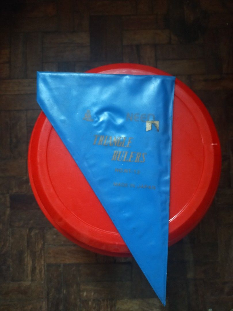 Triangle Ruler Set with Case – Made in Japan (Category: Stationery & School Supplies) located in Manila. Submitted by warmshark.1ae1ea (Listing ID 1457979142, Image 3). Description: Triangle ruler set with original blue case. Made in Japan (NEED, No. NT-12). Used condition, with some signs of use but still usable. Selling as a set with case. ₱100 📍 Manila PM if interested..