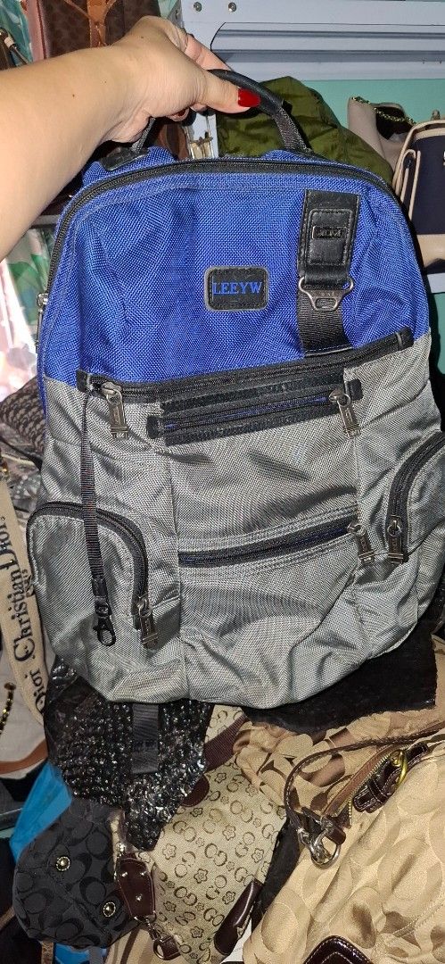 Tumi Backpack Blue Grey Nylon (Category: Backpacks) located in Tagum. Submitted by annukay (Listing ID 1457909469, Image 1). Description: - Brand: Tumi - Color: Blue and Grey - Material: Durable Nylon - Features: Multiple zippered compartments for organization - Comfort: Padded straps - Ideal for: Travel or daily use - Condition: Please check photos for details.